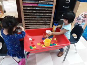 Developing cause and effect skills in the sensory table